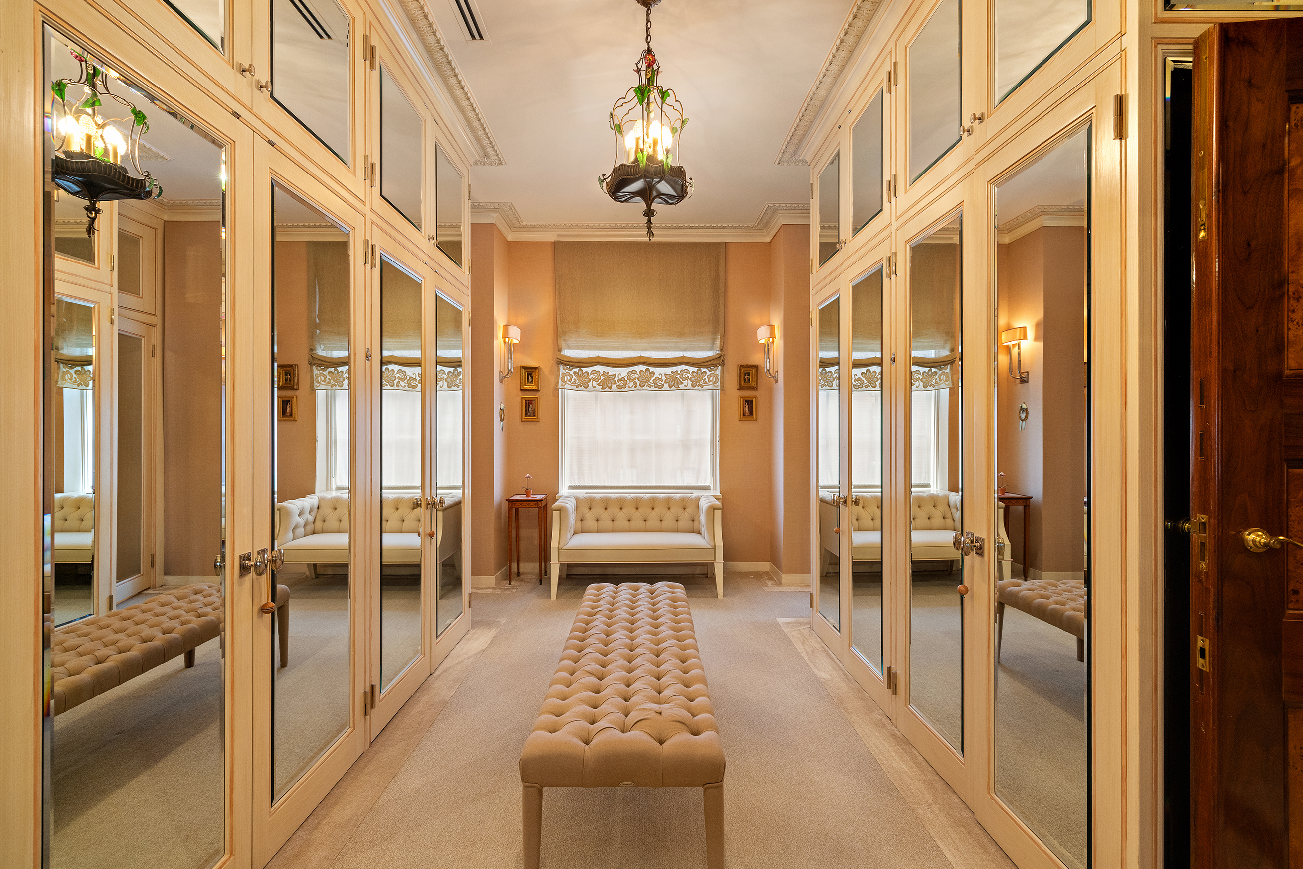 778 Park Avenue, Unit 8 Manhattan, NY 10021 - Photo 15 of 20 a view of a hallway with furniture and a chandelier