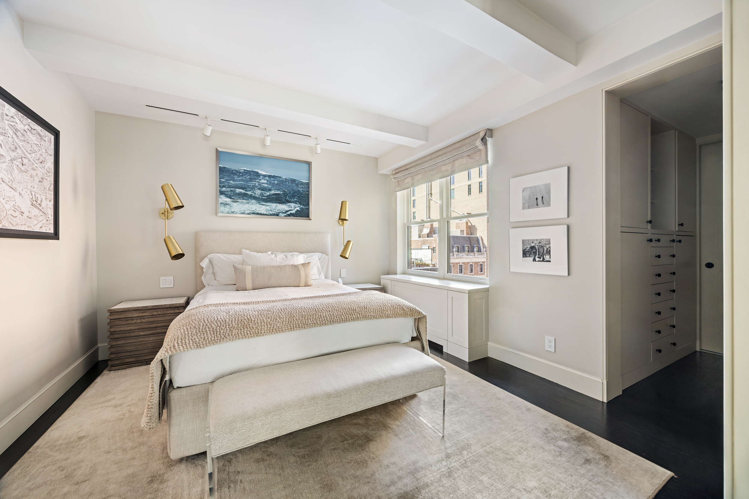 169 East 78th Street, Unit 7C Manhattan, NY 10075 - Photo 19 of 30 a bedroom with a bed and wooden floor