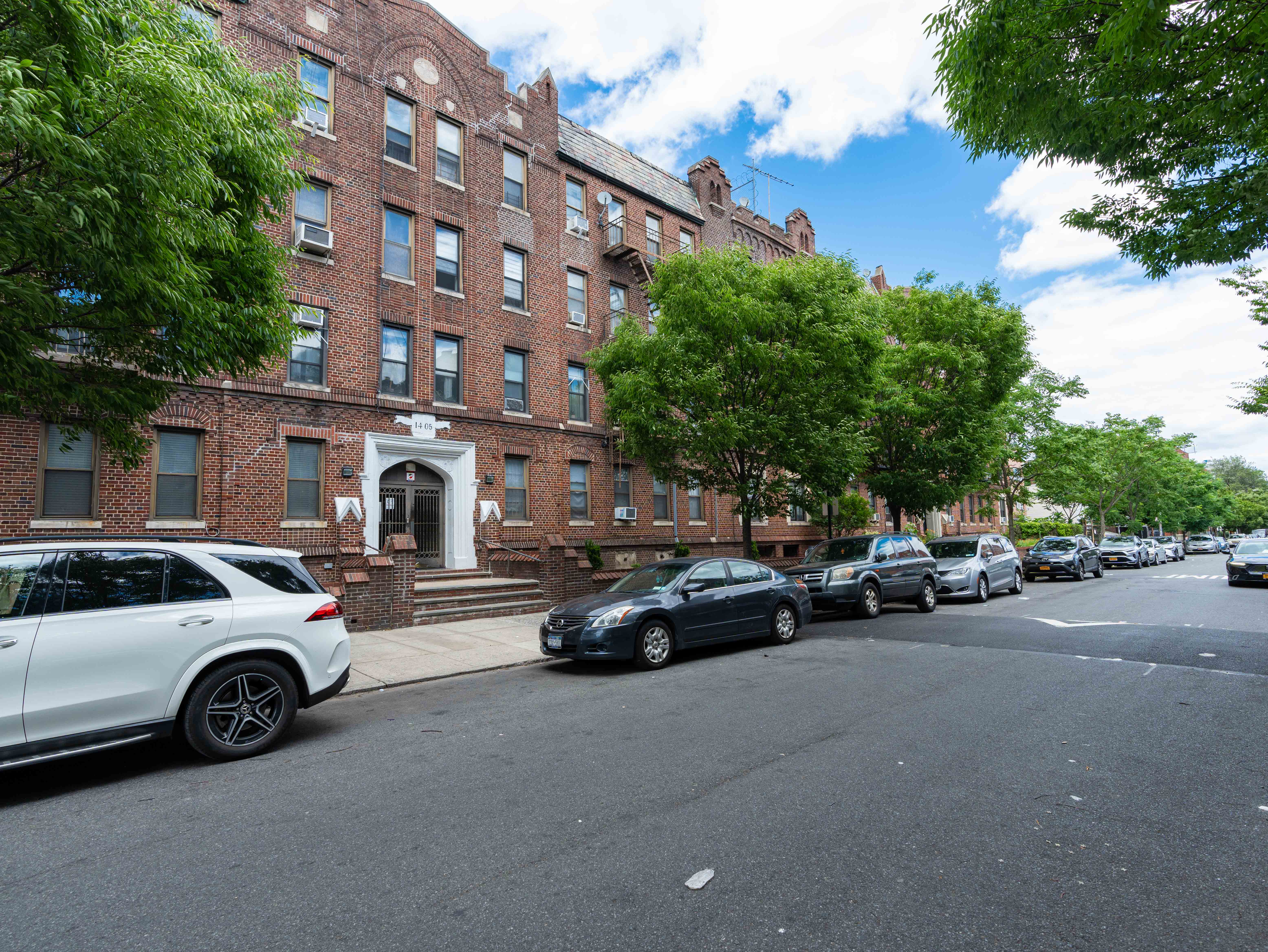1405 Prospect Place, Unit B11 Brooklyn, NY 11213 - Photo 11 of 12 a view of a cars parked in front of a building