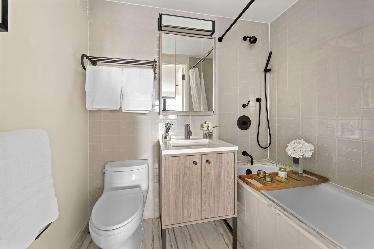 175 West 95th Street, Unit 19F Manhattan, NY 10025 - Photo 10 of 16 a bathroom with a sink toilet and shower