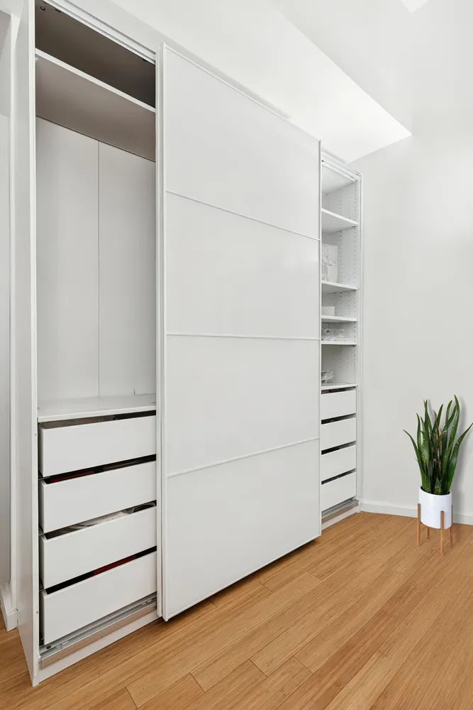 a view of walk in closet with empty racks