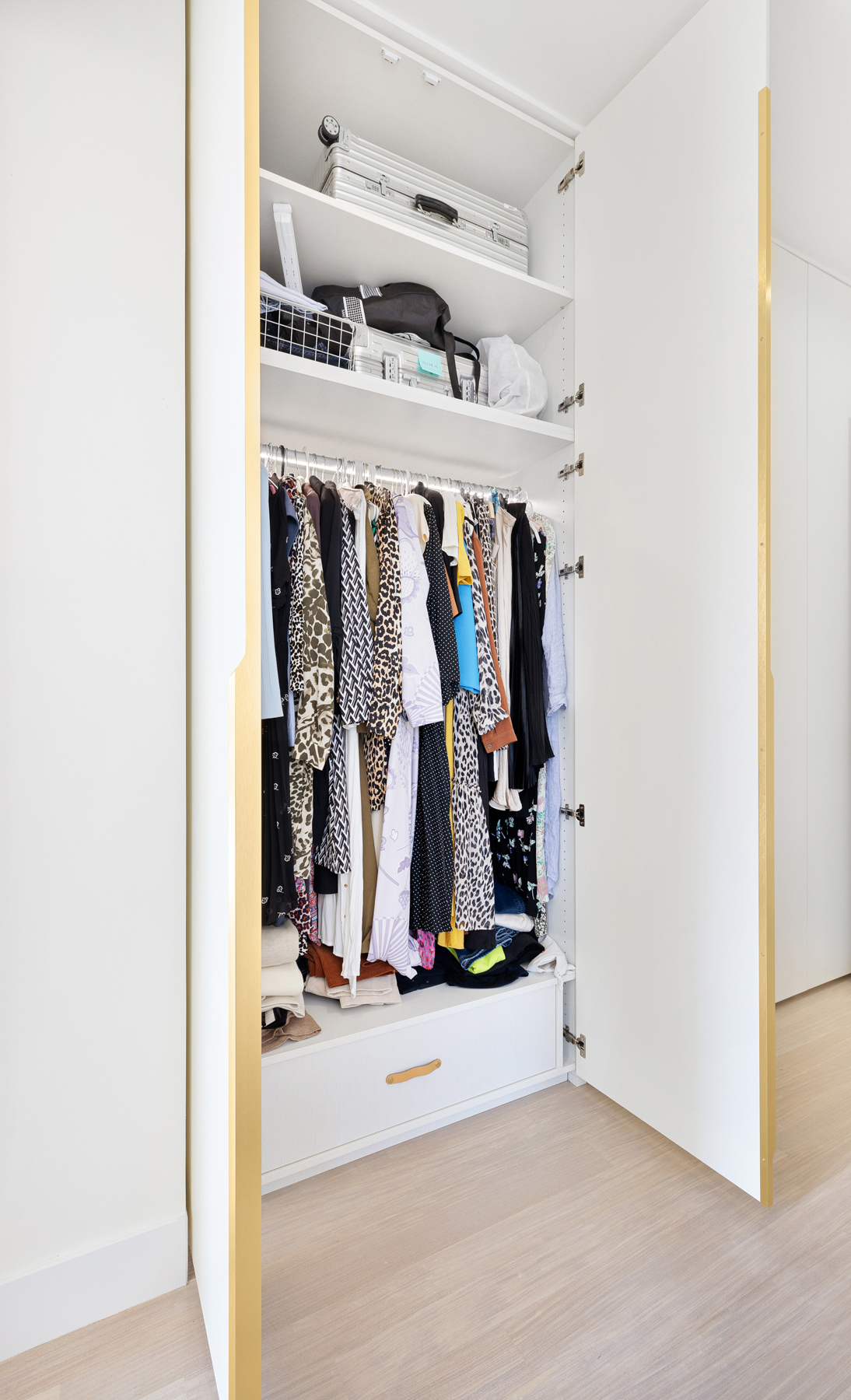 10 West End Avenue, Unit 30C Manhattan, NY 10023 - Photo 12 of 22 a view of walk in closet with clothes and shoes