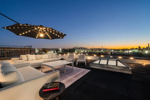 a view of a terrace with furniture
