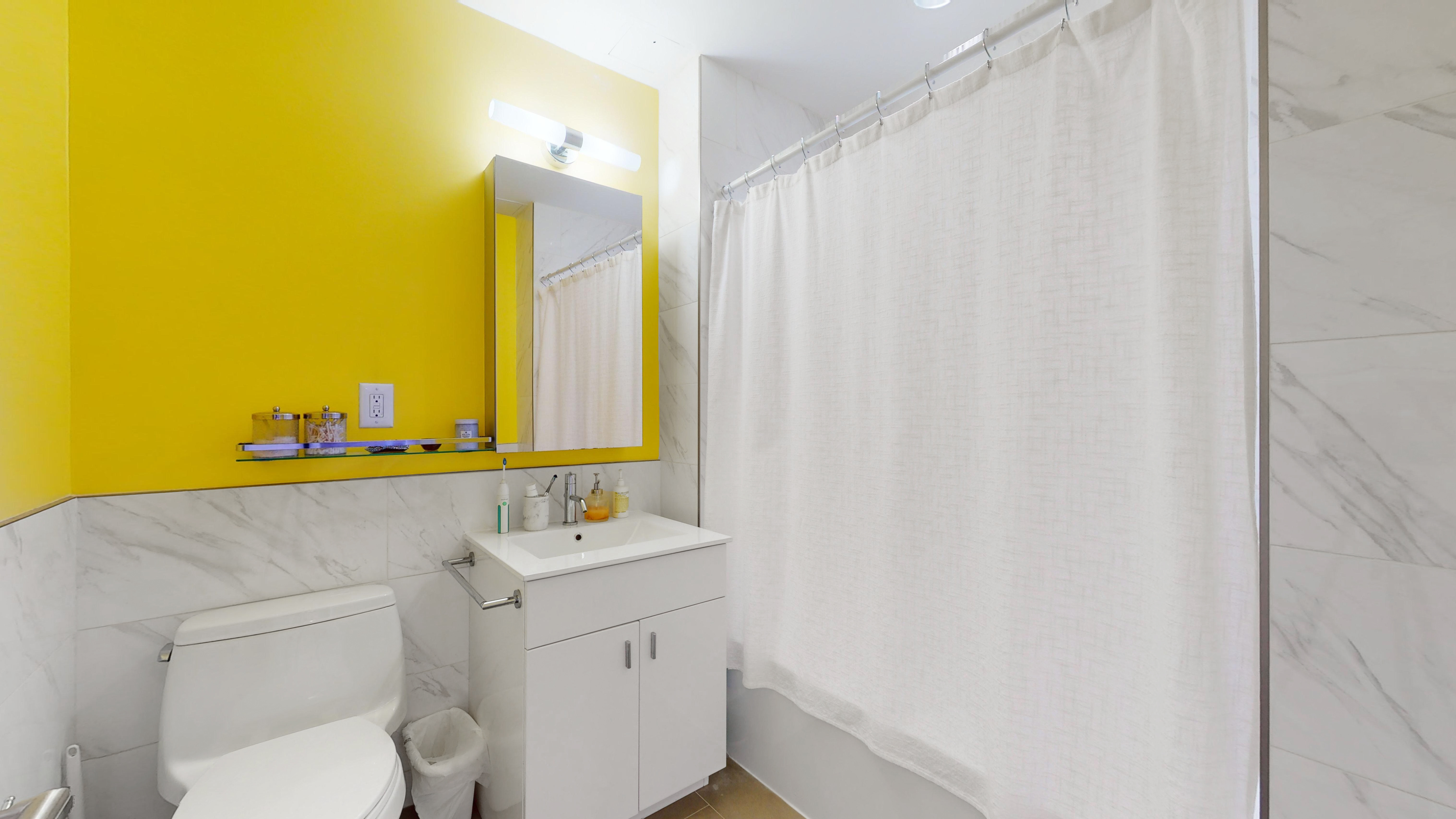 171 West 131st Street, Unit 620 Manhattan, NY 10027 - Photo 9 of 17 a bathroom with a sink and a mirror