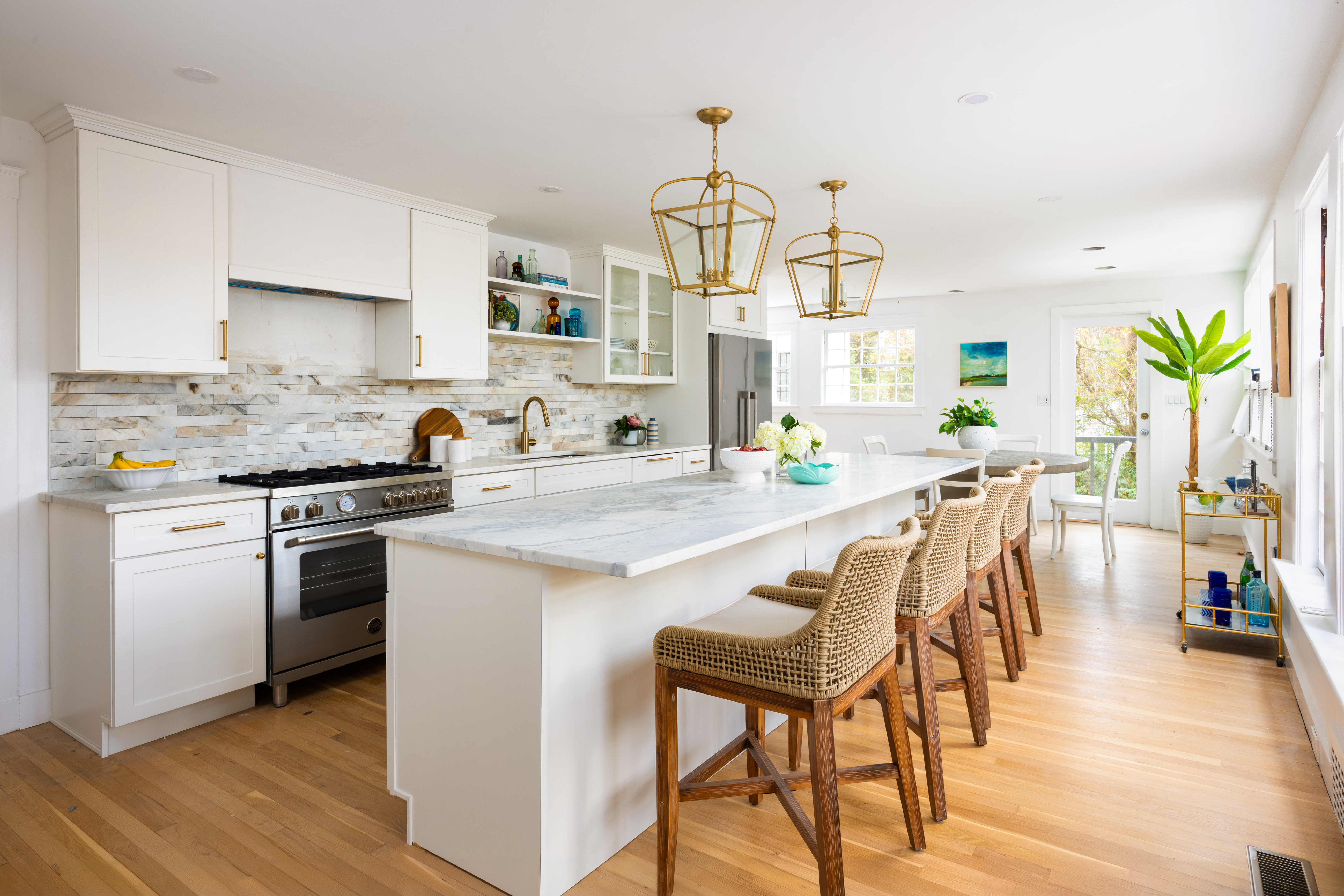111 Beverly Road Brookline, MA 02467 - Photo 9 of 27 a kitchen with a table chairs stove and cabinets