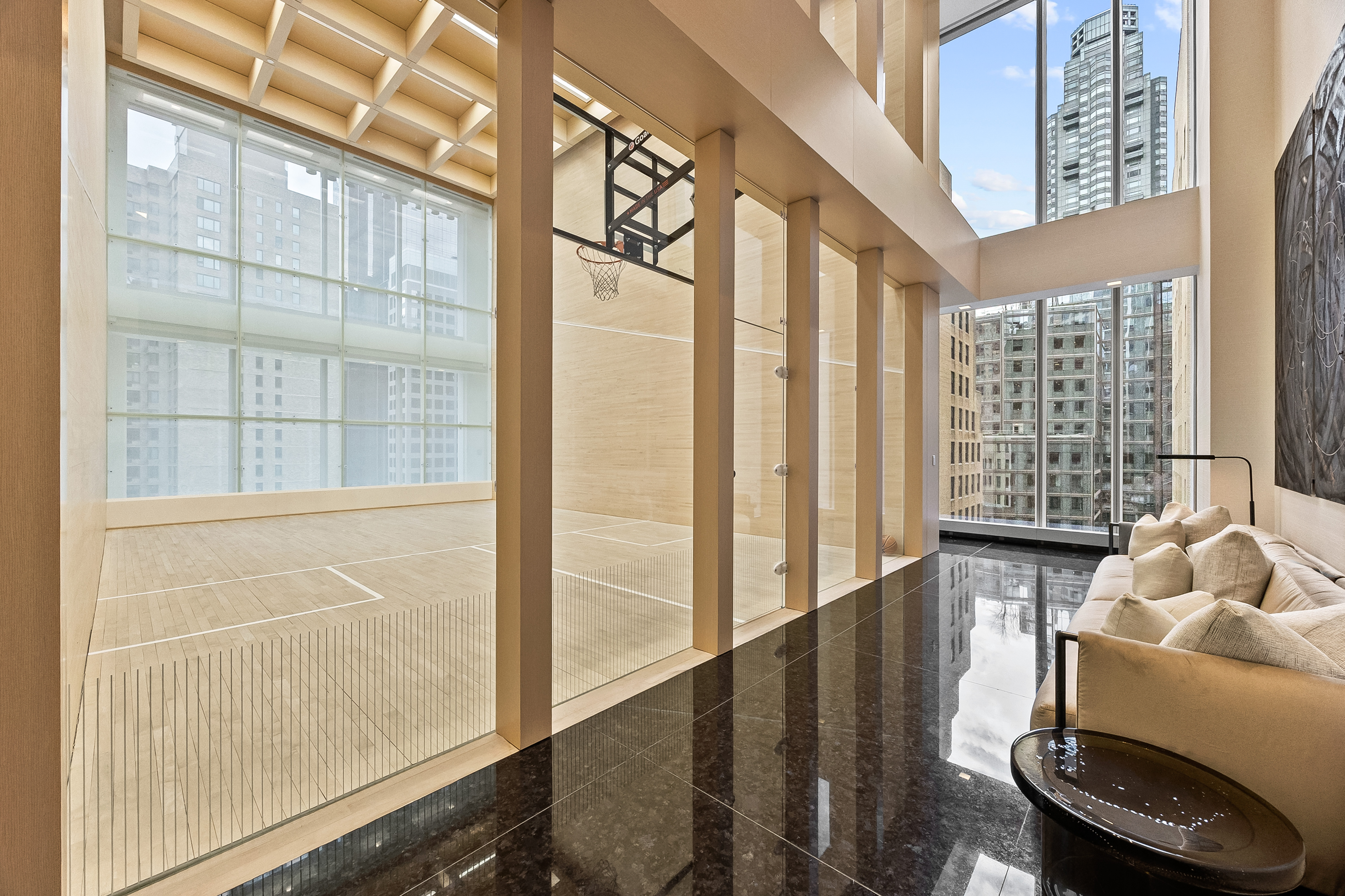 217 West 57th Street, Unit 36D Manhattan, NY 10019 - Photo 25 of 26 a living room with furniture and large windows