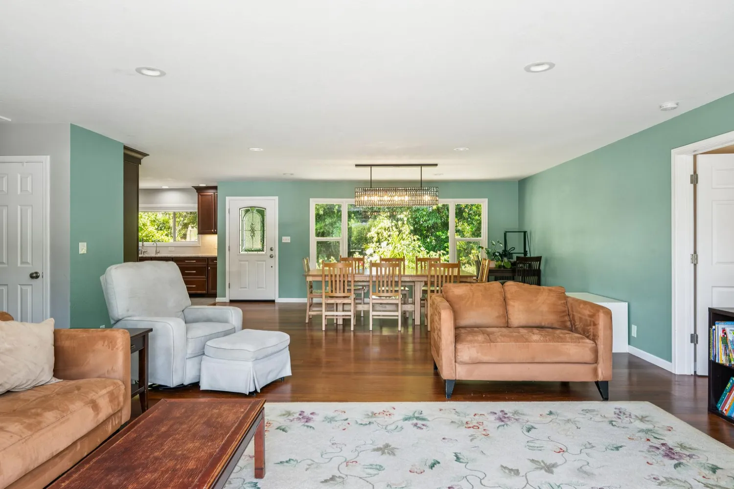 a kitchen with stainless steel appliances granite countertop a sink stove and wooden cabinets