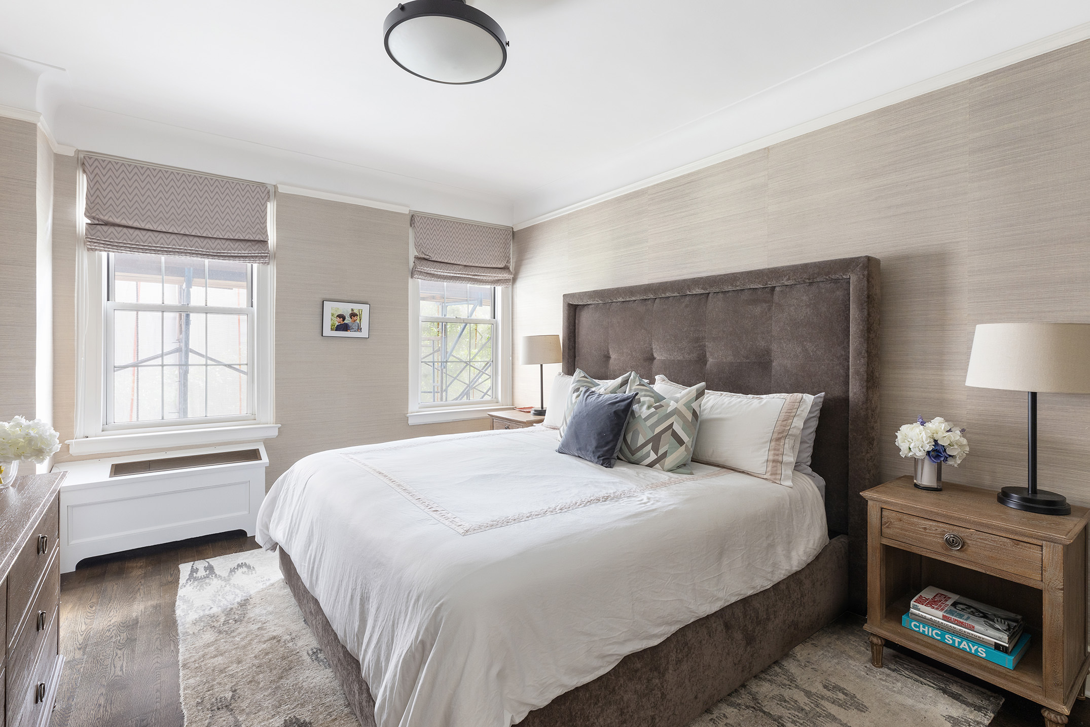 174 West 76th Street, Unit 4GH Manhattan, NY 10023 - Photo 7 of 16 a bedroom with a bed and a window