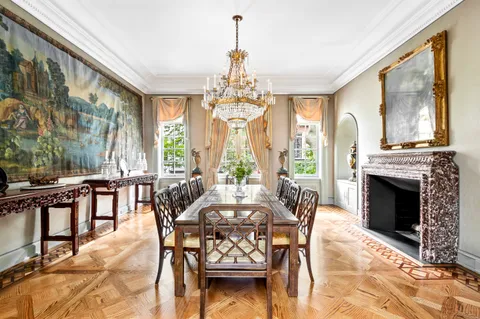 a view of a dining room and hall with furniture