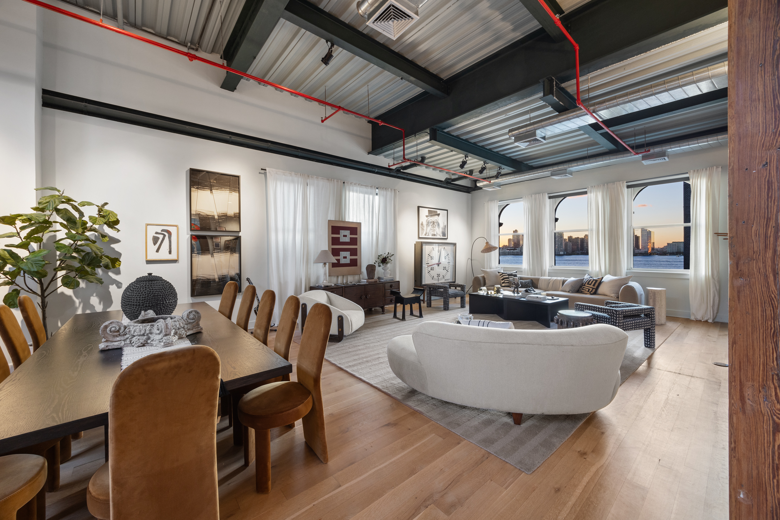 481 Washington Street, Unit PHS Manhattan, NY 10013 - Photo 1 of 20 a dining room with furniture a chandelier and wooden floor