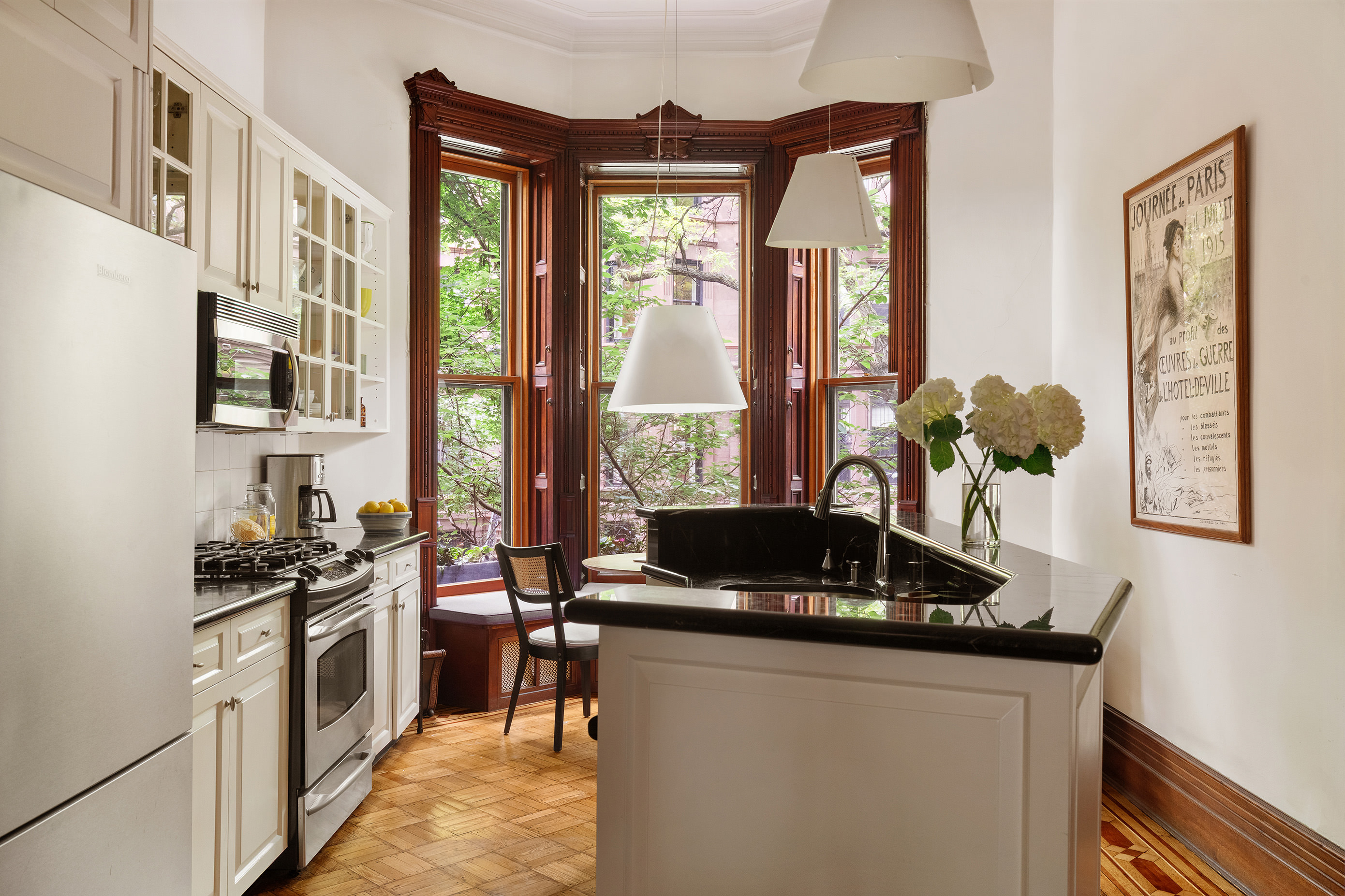 836 President Street Brooklyn, NY 11215 - Photo 8 of 23 a kitchen with stainless steel appliances a stove a sink and a chandelier