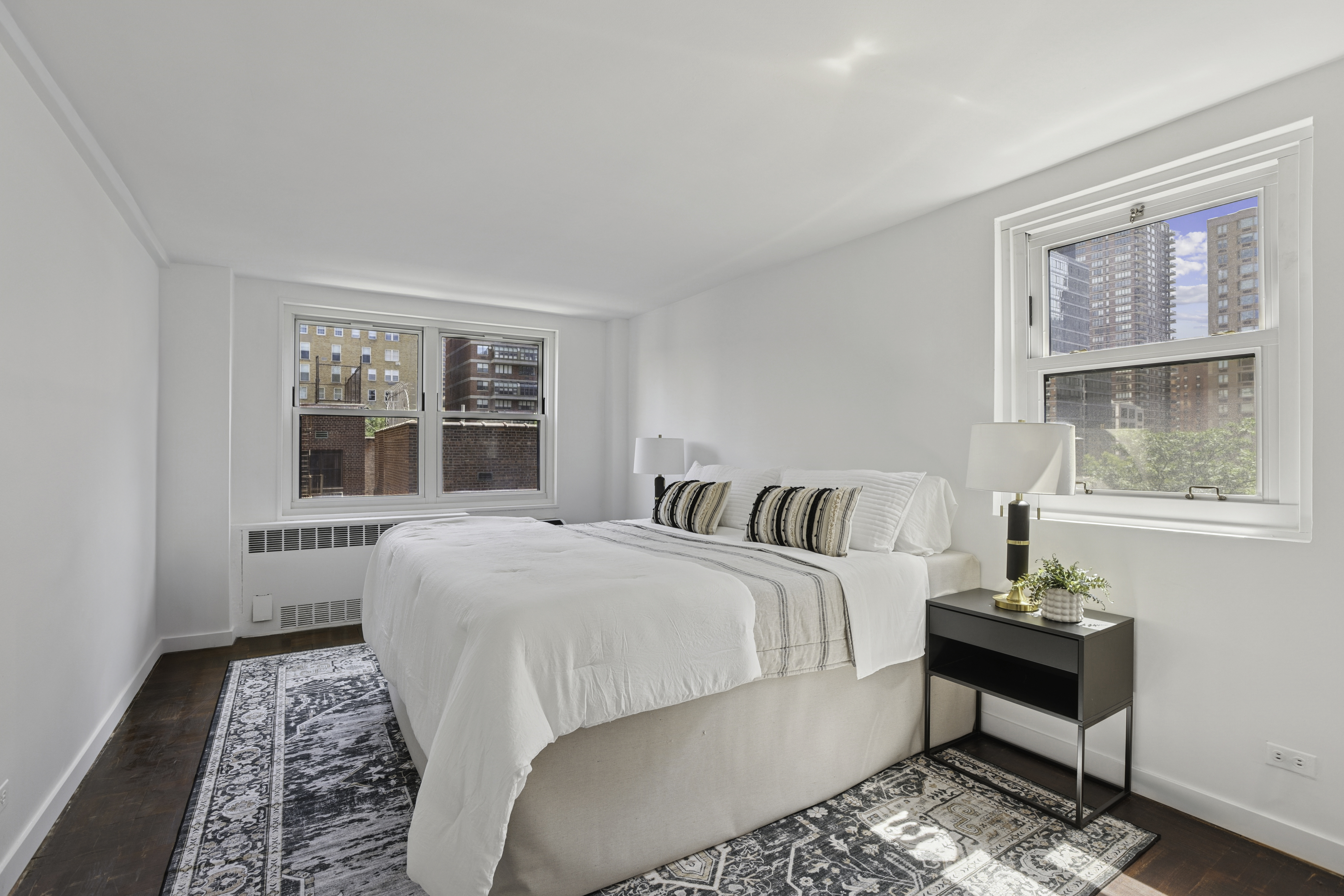 315 East 70th Street, Unit 7D Manhattan, NY 10021 - Photo 2 of 16 a bedroom with a bed and a window