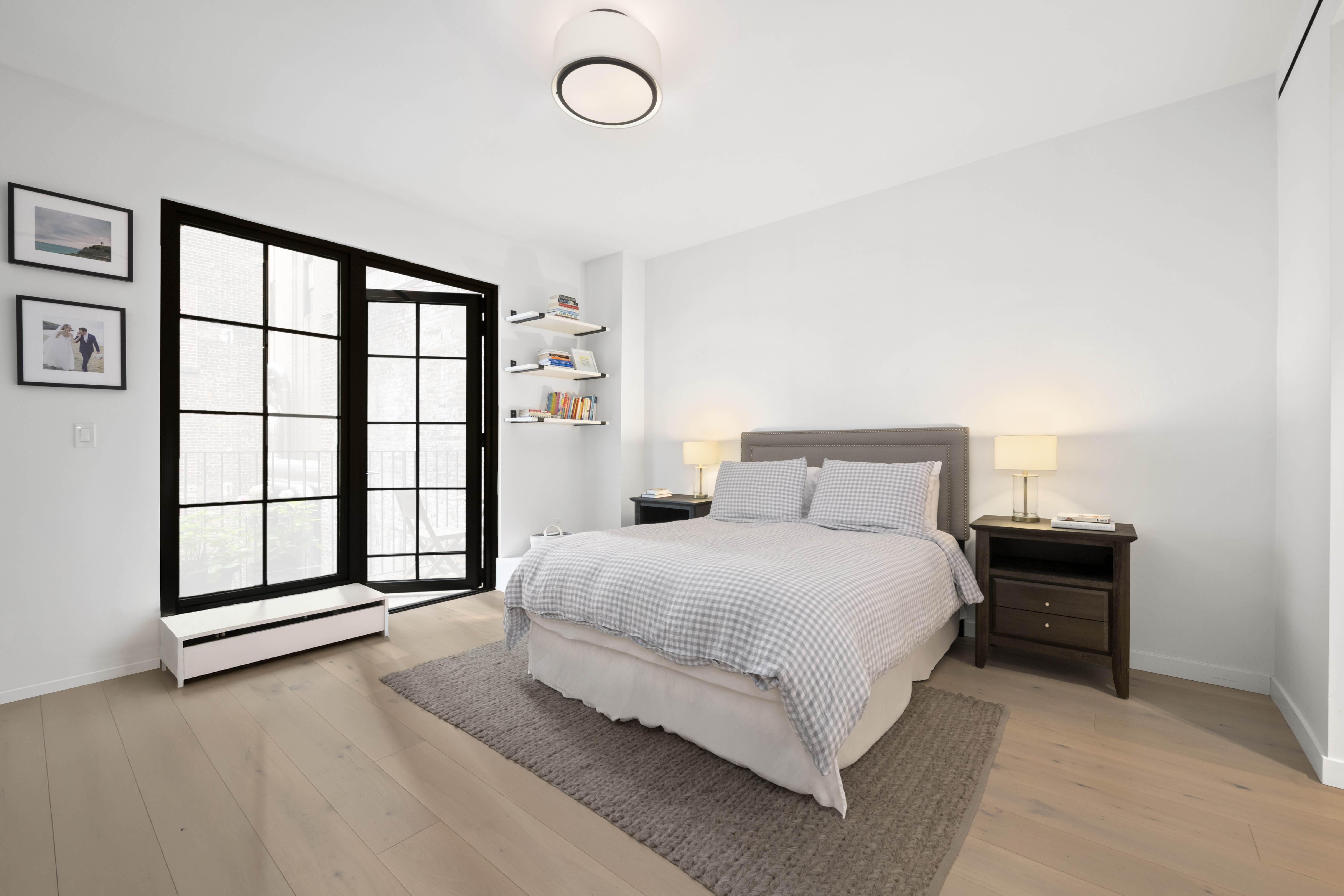 225 West 17th Street, Unit 6B Manhattan, NY 10011 - Photo 5 of 11 a spacious bedroom with a bed and a large window