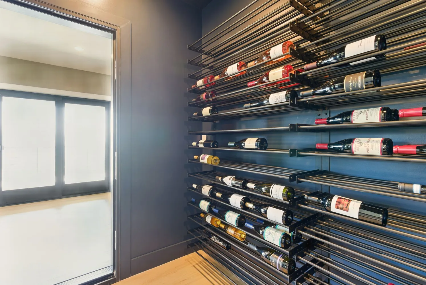 a bedroom with a bed and glass door