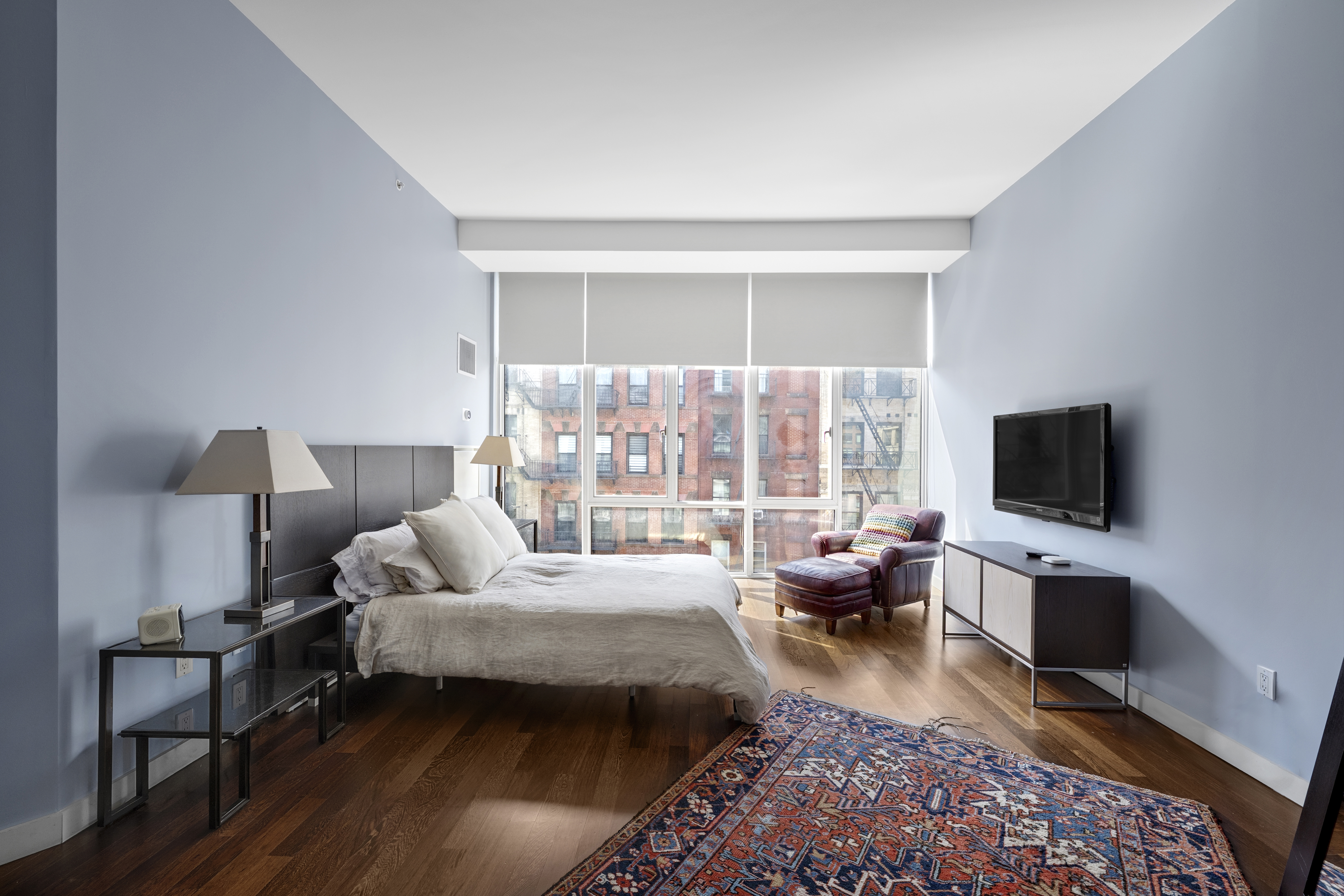475 Greenwich Street, Unit 5B Manhattan, NY 10013 - Photo 6 of 16 a living room with furniture and a flat screen tv