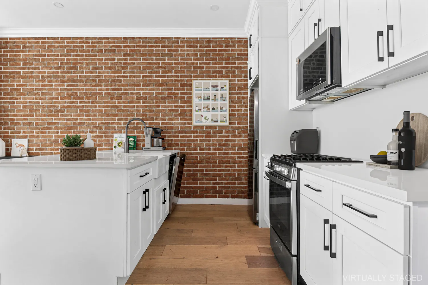 a kitchen with stainless steel appliances a stove refrigerator sink and cabinets