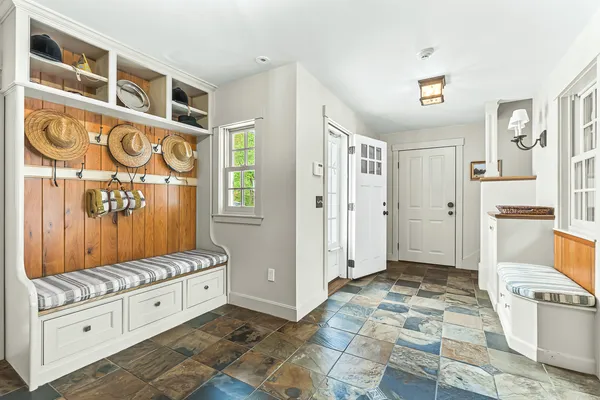 a spacious bedroom with a bed and a cabinets