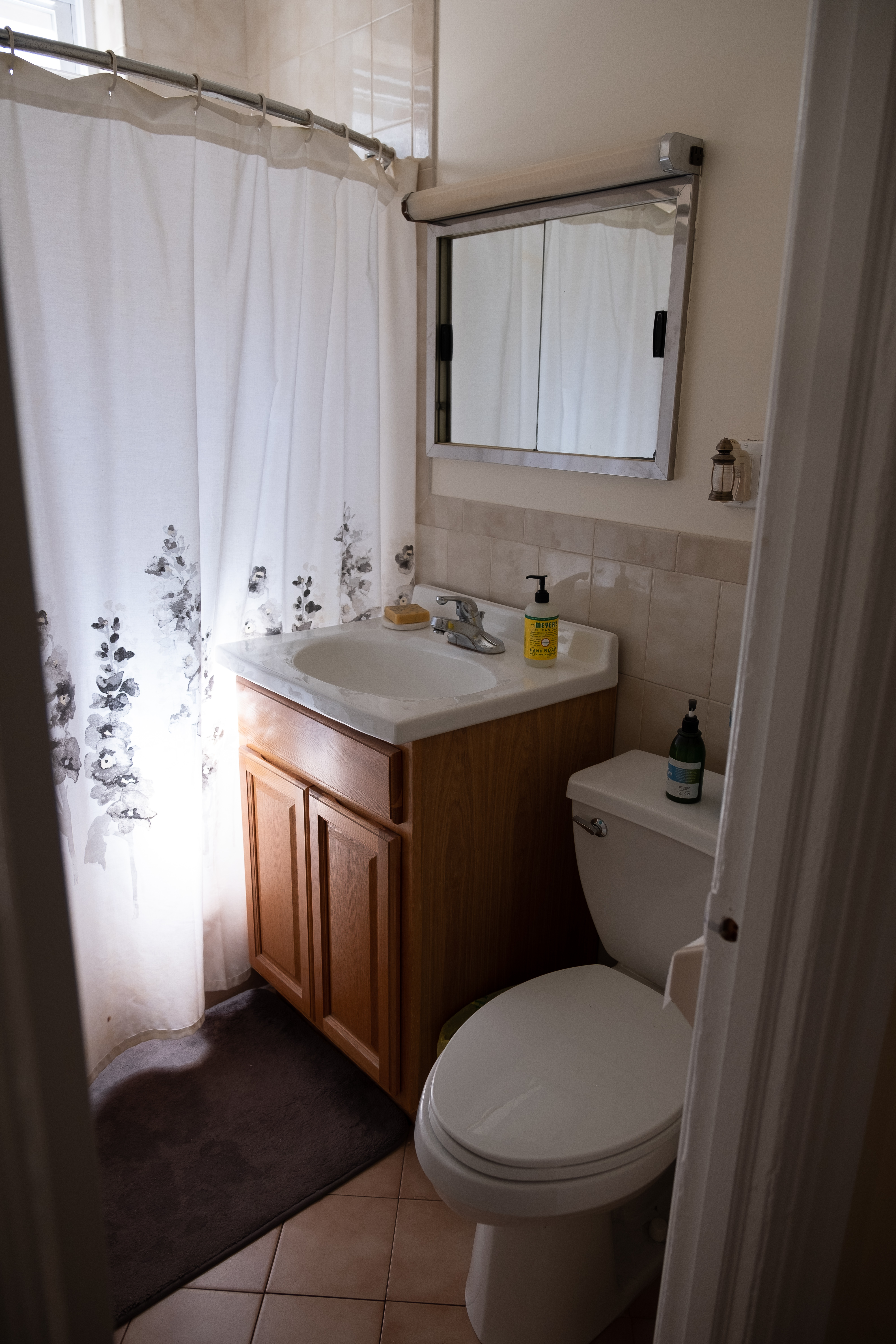 31-74 33rd Street, Unit 1R Queens, NY 11106 - Photo 3 of 5 a bathroom with a sink a toilet and mirror