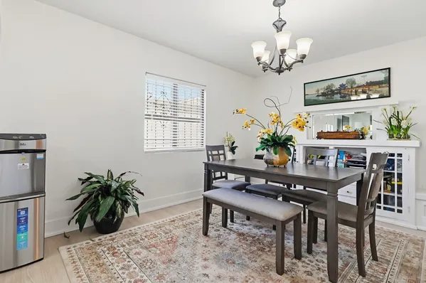 a dining room with furniture and window