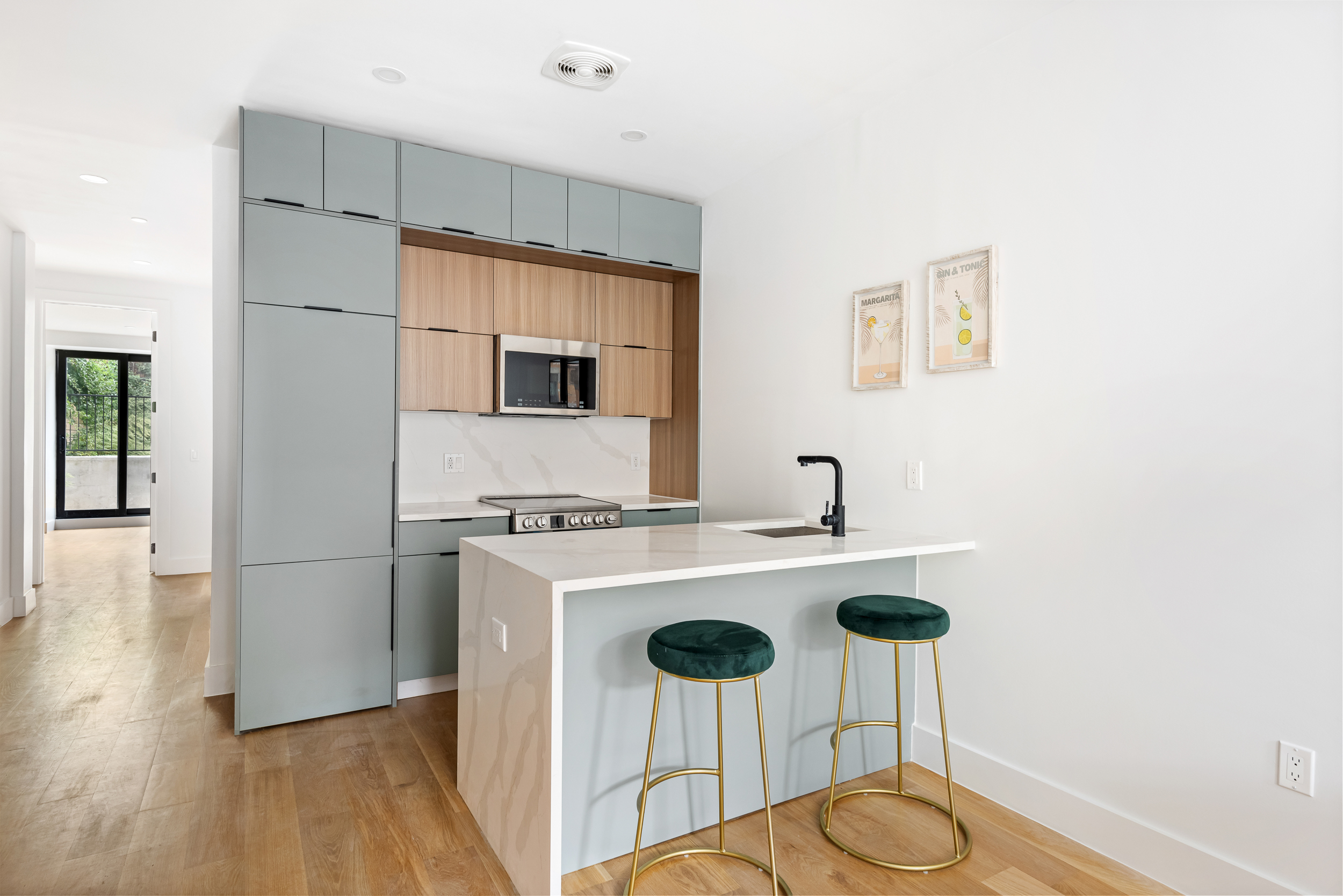 140 Moffat Street, Unit 1 Brooklyn, NY 11207 - Photo 3 of 9 a kitchen with a refrigerator a stove a sink and a refrigerator