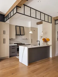 a kitchen with stainless steel appliances granite countertop a sink and stove top oven