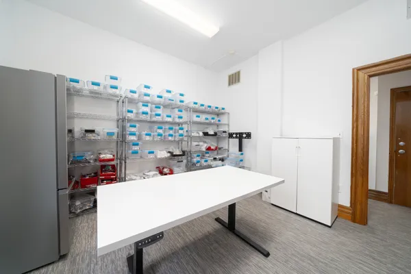 a room with a table and chairs