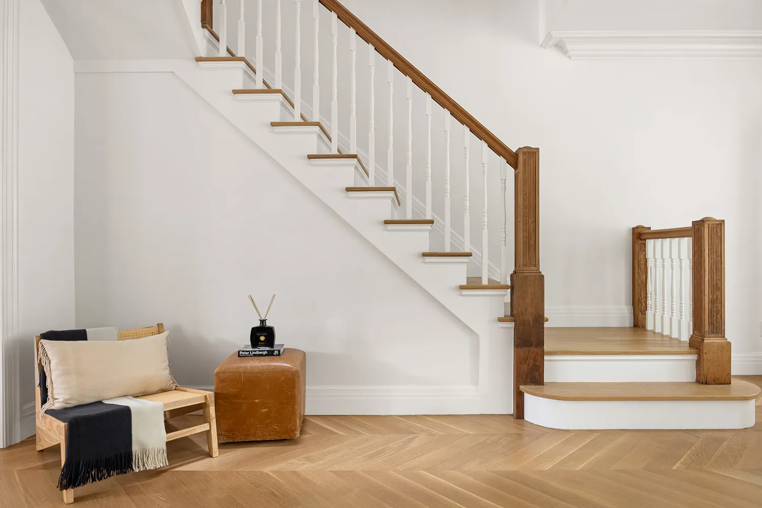 a living room with furniture and a potted plant