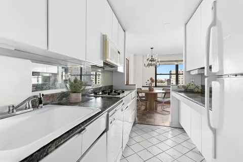 a kitchen with counter top space and appliances