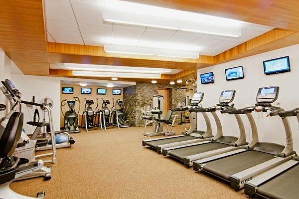 99 John Street, Unit 813 Manhattan, NY 10038 - Photo 10 of 20 a view of a room with gym equipment