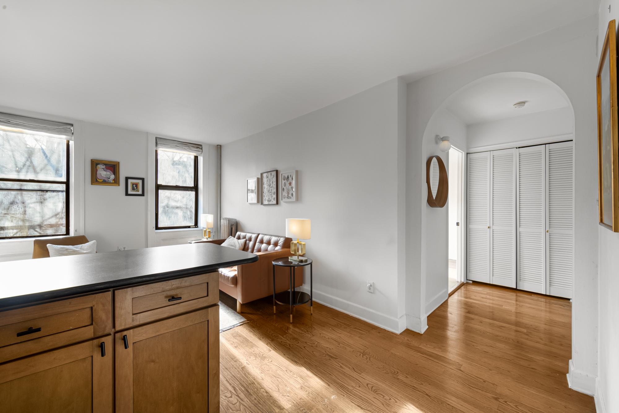504 East 6th Street, Unit 5 Manhattan, NY 10009 - Photo 5 of 11 a view of a kitchen with cabinets and wooden floor