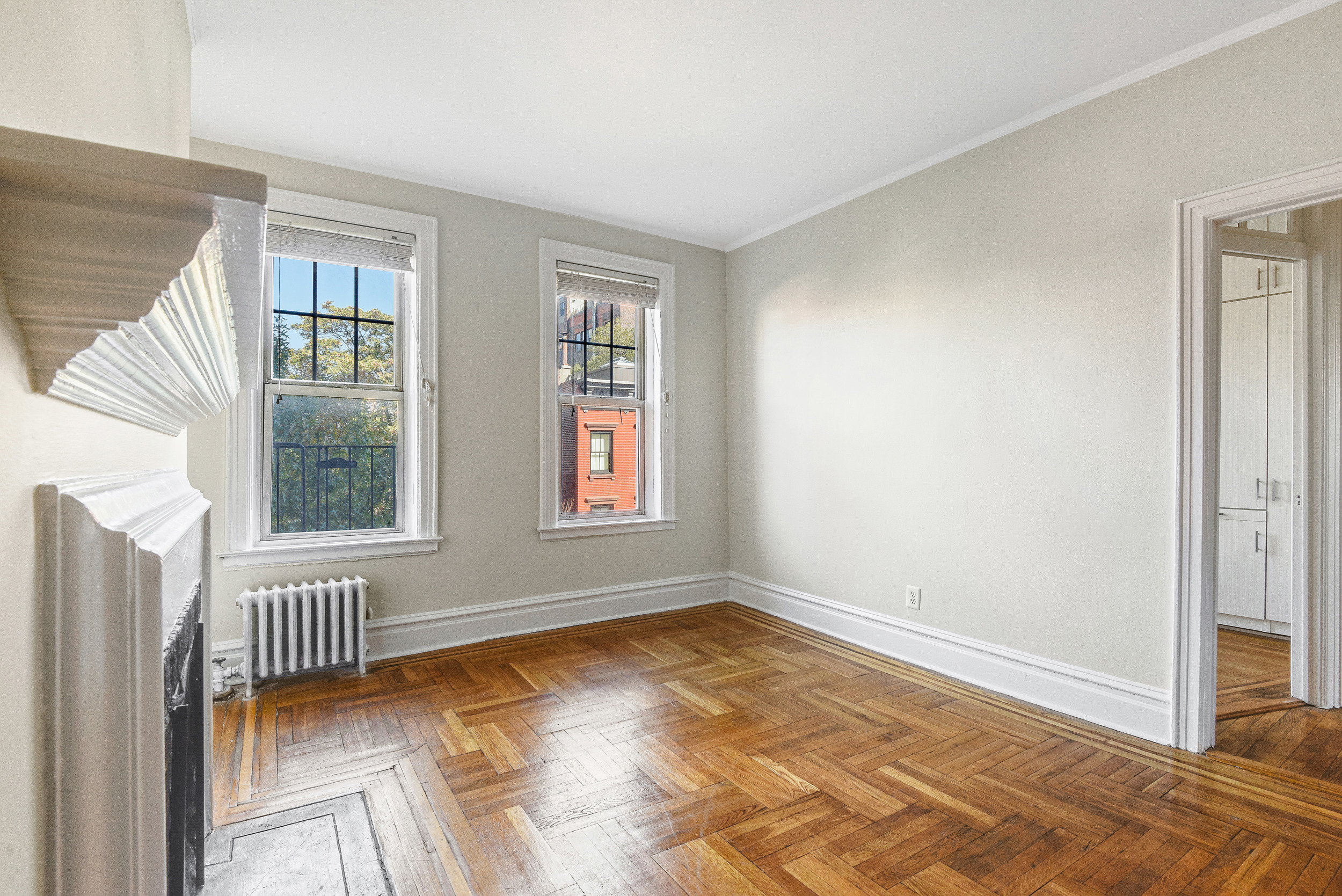 344 West 12th Street, Unit 5C Manhattan, NY 10014 - Photo 3 of 11 an empty room with windows
