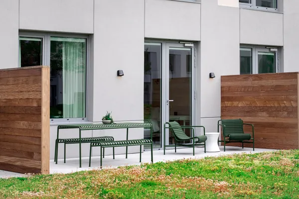 a view of two chairs in a patio