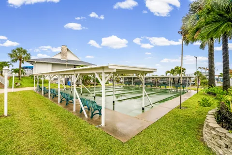 a view of a swimming pool with outdoor seating