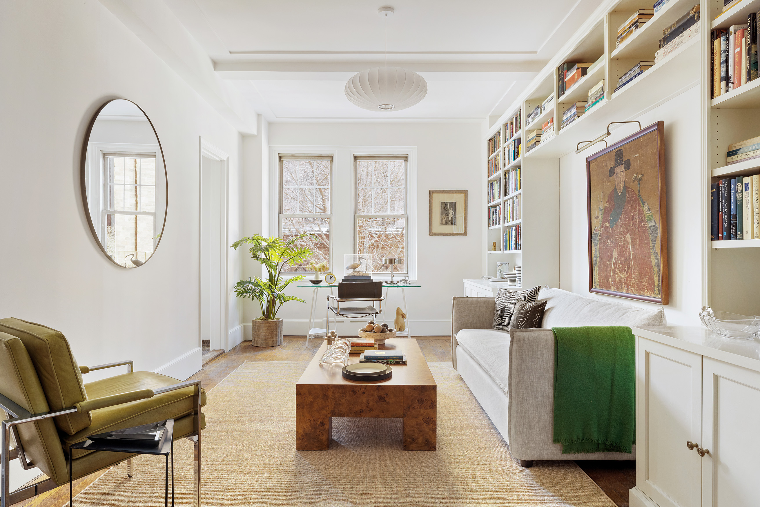 30 5th Avenue, Unit 4F Manhattan, NY 10011 - Photo 1 of 15 a living room with furniture a table and a potted plant