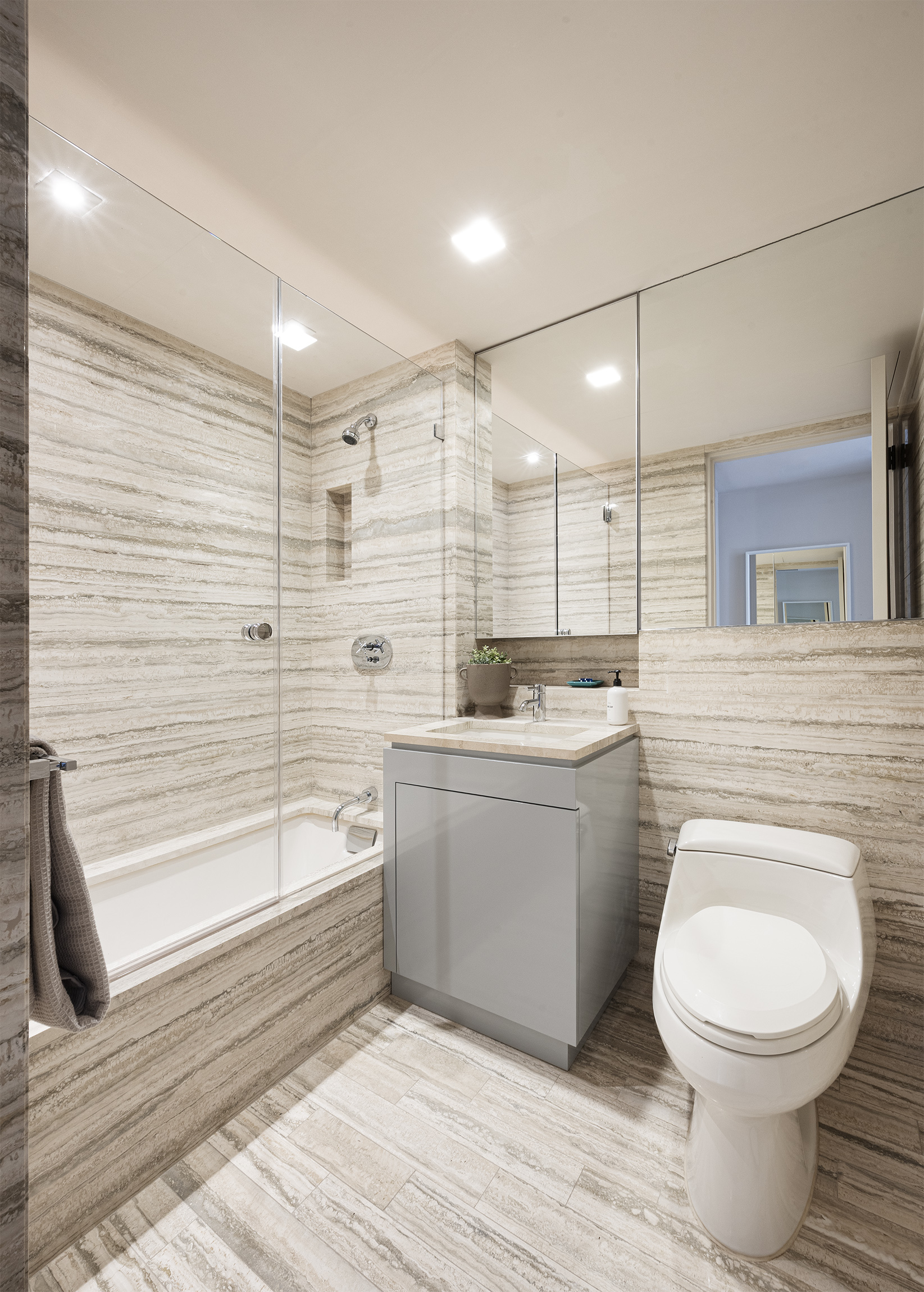 170 East End Avenue, Unit 2A Manhattan, NY 10128 - Photo 13 of 16 a bathroom with a toilet a sink and bathtub