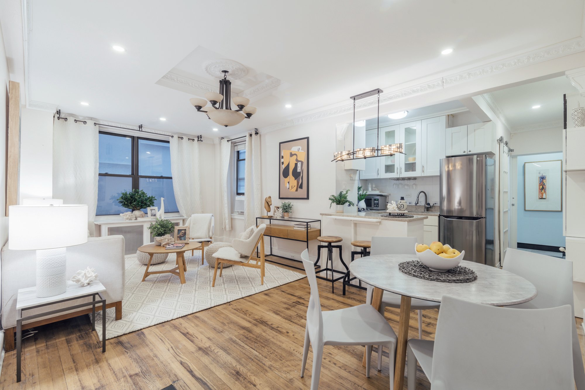 a view of a dining room with furniture and wooden floor