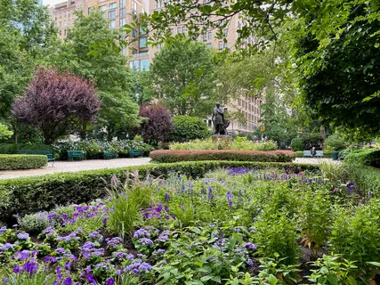 a view of a garden with a fountain