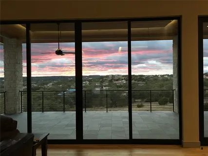 a view of a glass door with a living room