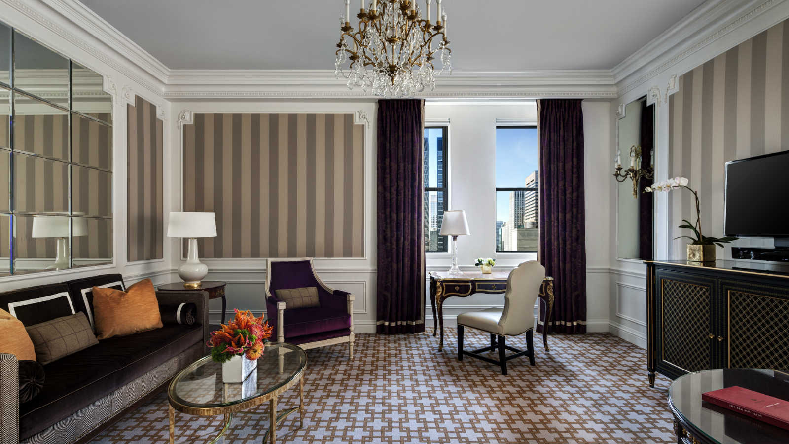 2 East 55th Street, Unit 935W39 Manhattan, NY 10022 - Photo 1 of 11 a living room with furniture a dining table and a chandelier