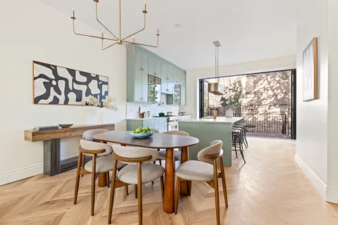 a view of a dining room with furniture window and outside view