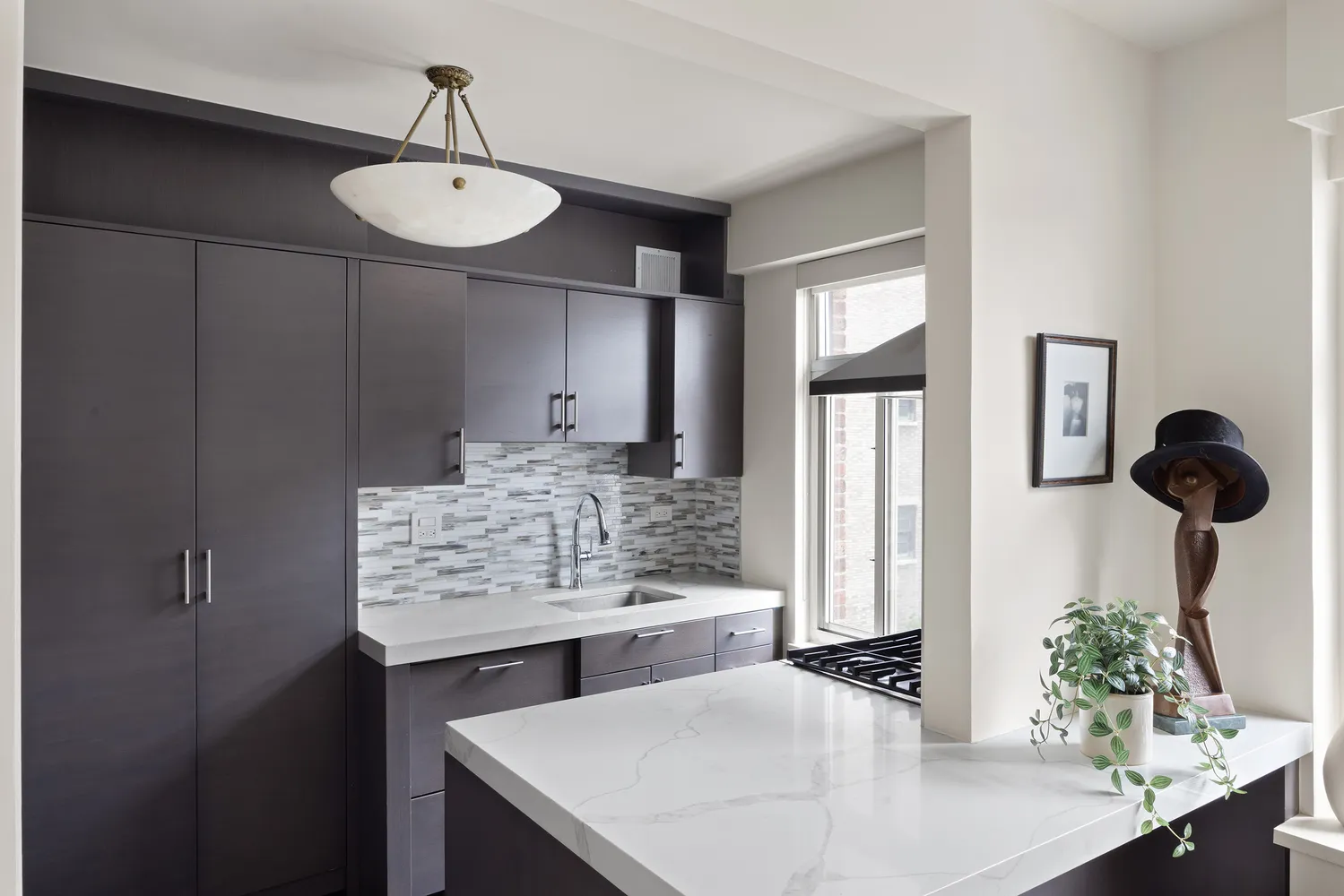 a view of kitchen island with stainless steel appliances kitchen island granite countertop furniture and refrigerator