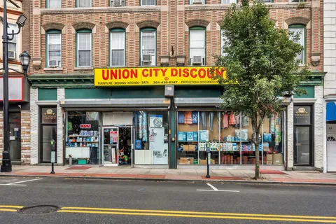 a view of a food mall next to a road