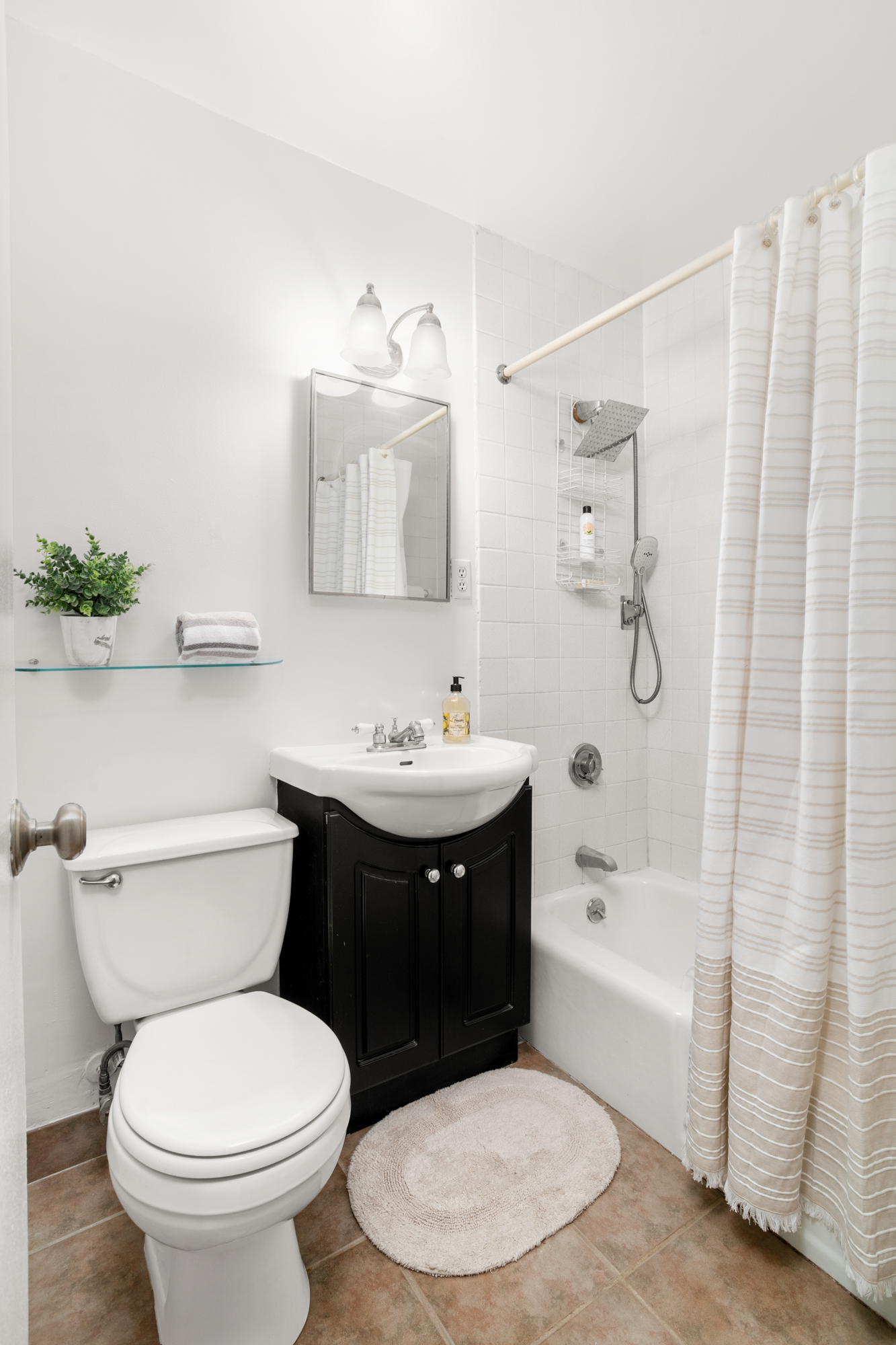609 Columbus Avenue, Unit 14E Manhattan, NY 10024 - Photo 18 of 24 a bathroom with a sink toilet and shower