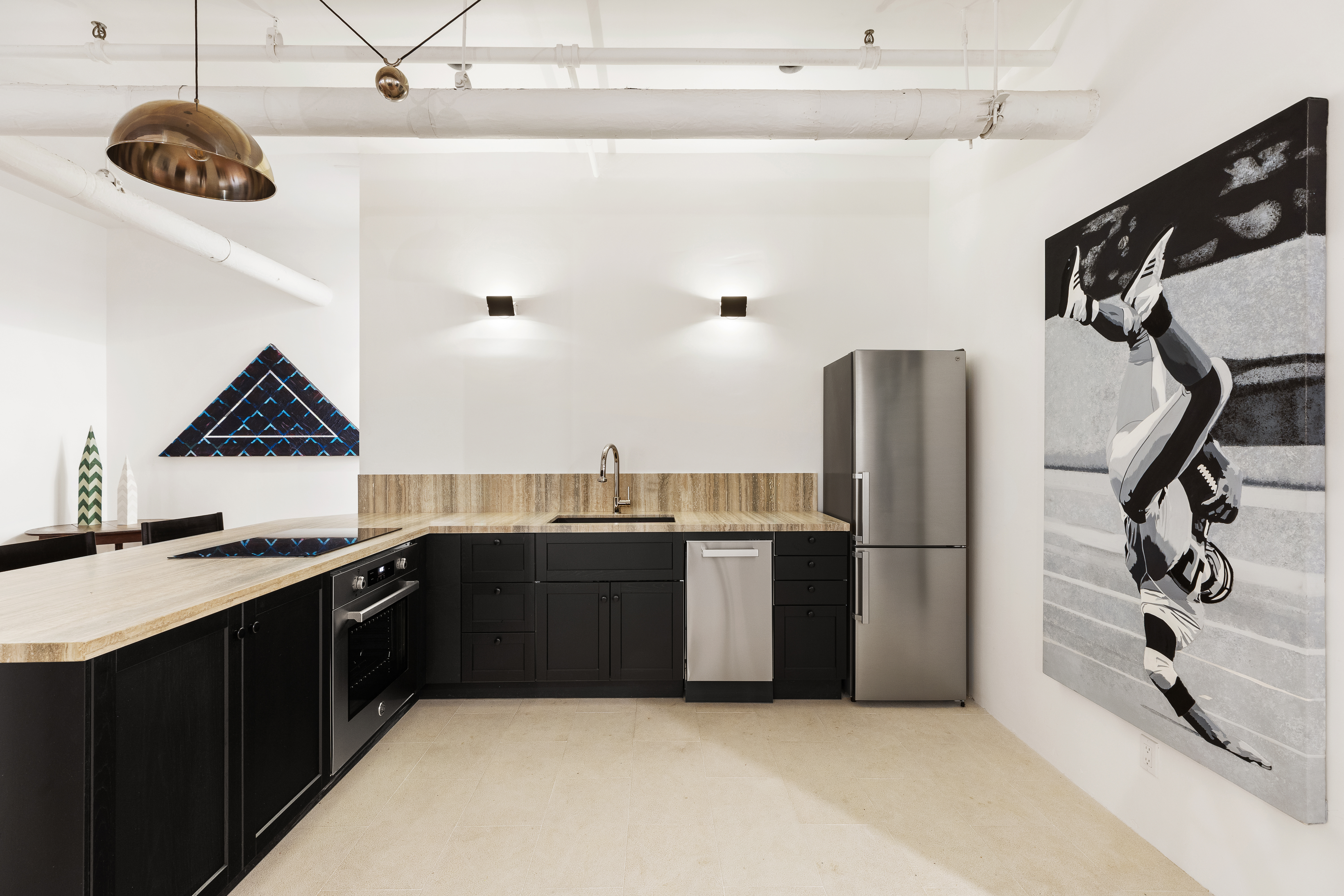144 Franklin Street, Unit B Manhattan, NY 10013 - Photo 5 of 14 a kitchen with stainless steel appliances granite countertop a sink a stove and a refrigerator