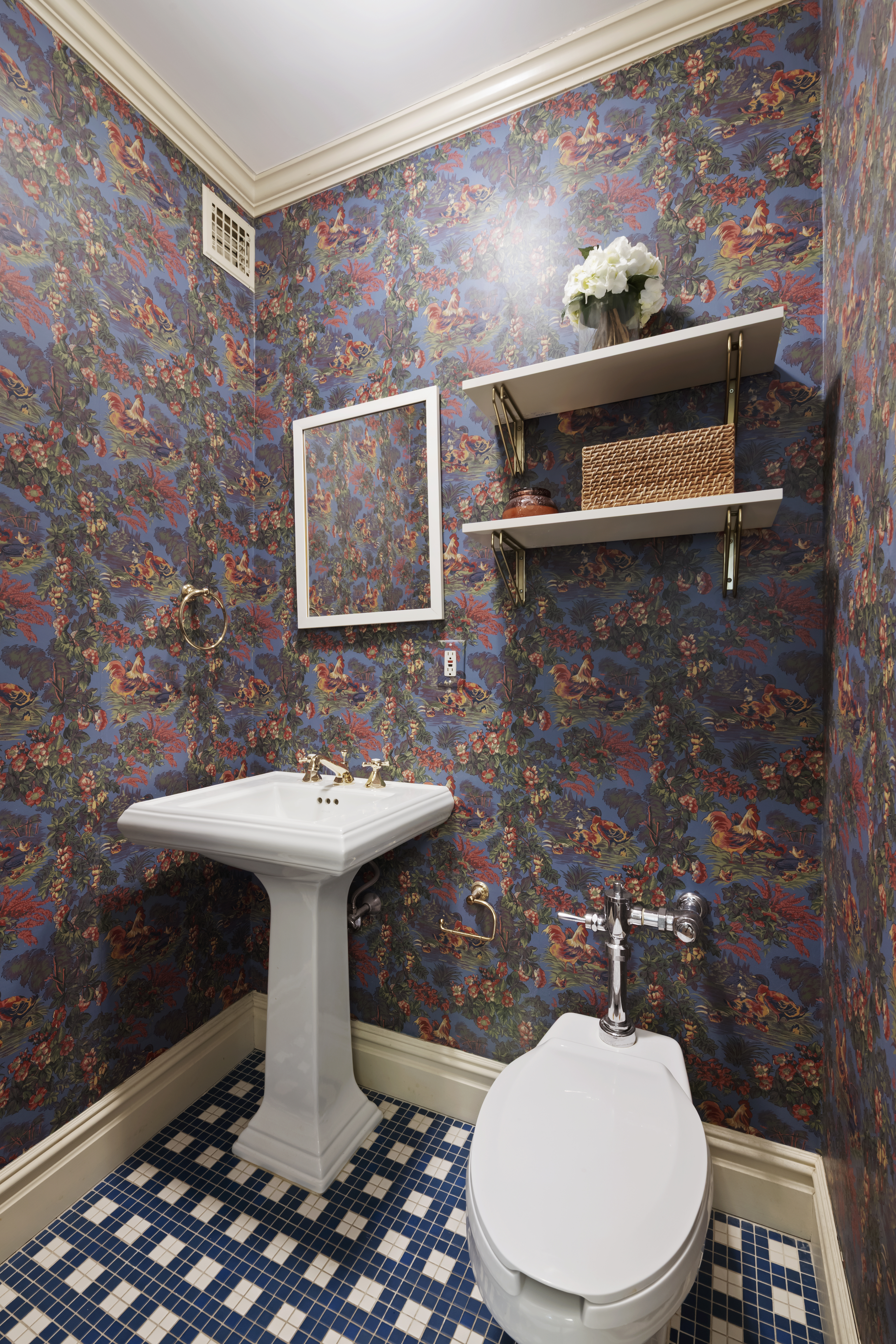 320 East 72nd Street, Unit 6A Manhattan, NY 10021 - Photo 12 of 13 a bathroom with a sink a toilet and mirror