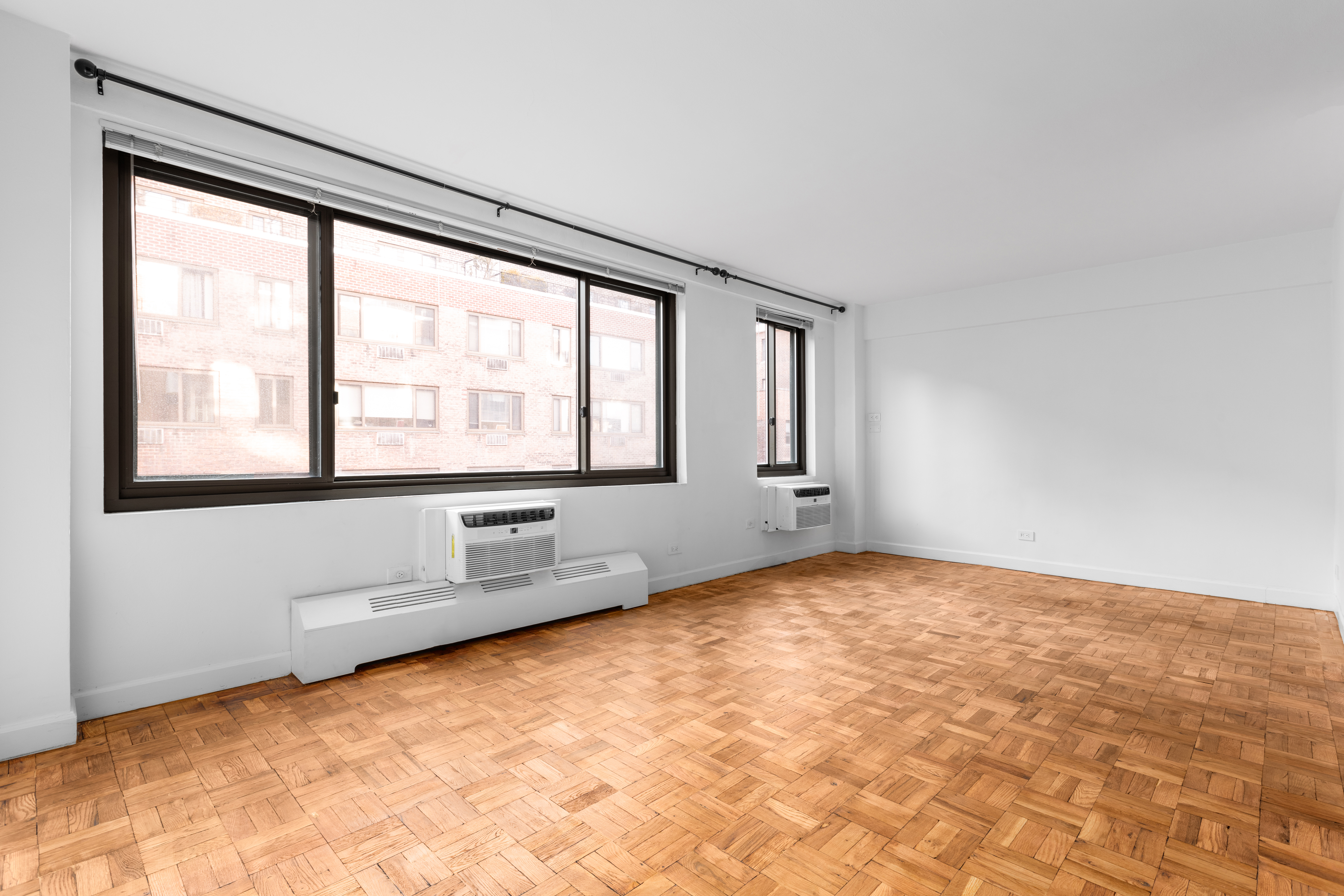 420 East 64th Street, Unit W10K Manhattan, NY 10065 - Photo 4 of 7 a view of an empty room with a window
