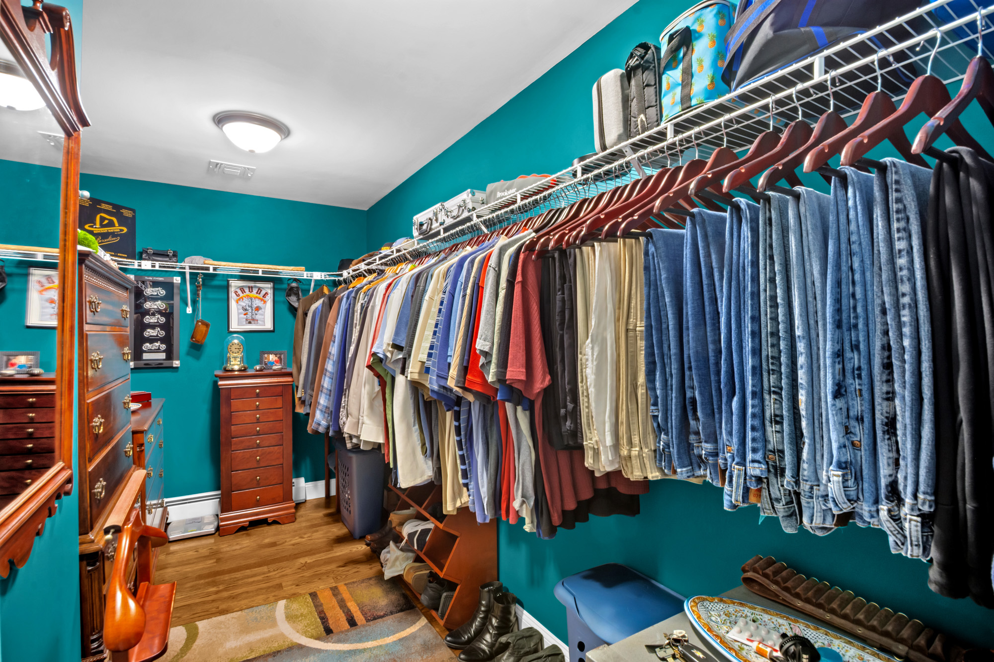 909 Jewett Avenue Staten Island, NY 10314 - Photo 26 of 65 a view of walk in closet with clothes and shoes