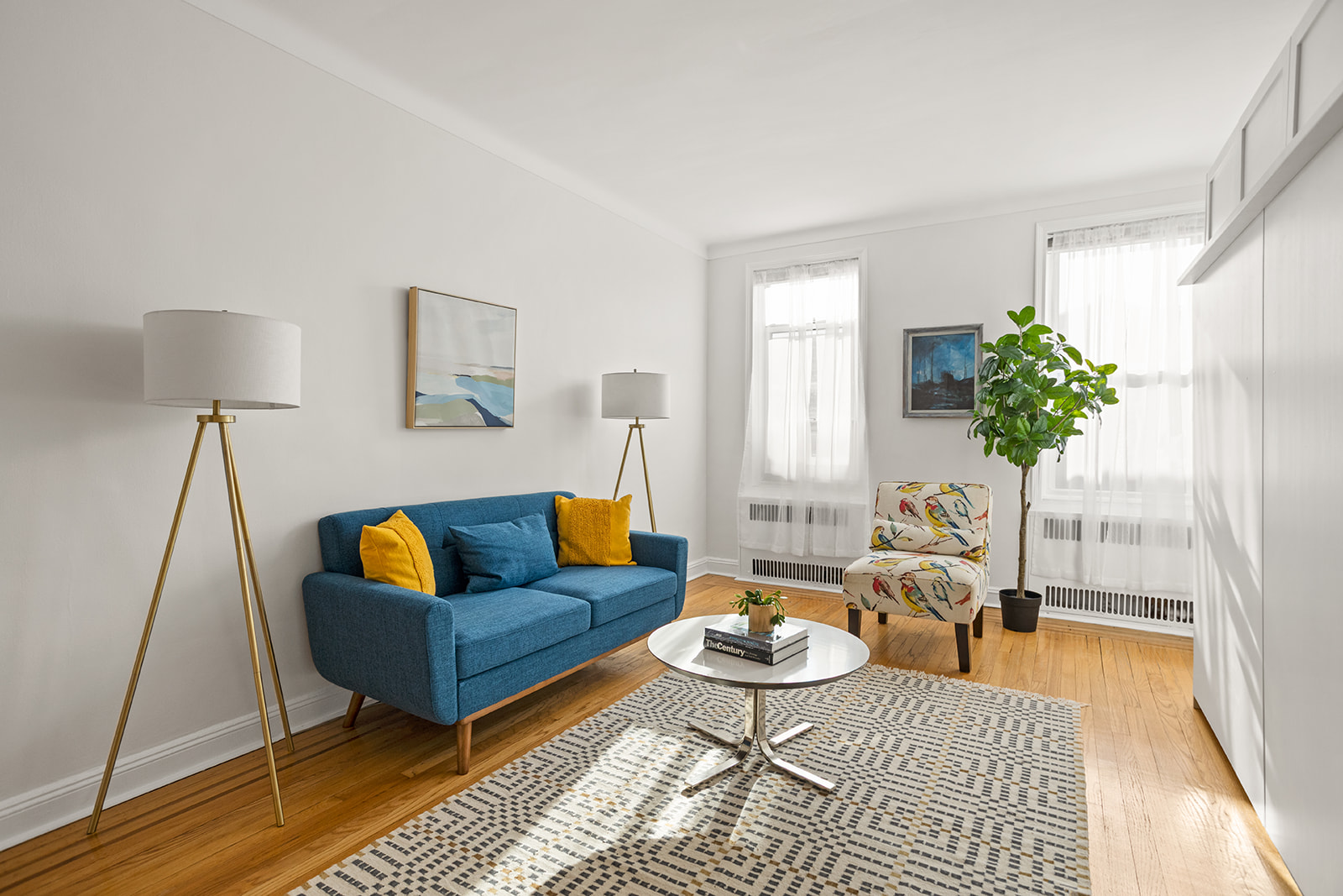 76-12 35th Avenue, Unit J6 Queens, NY 11372 - Photo 1 of 14 a living room with furniture and a rug