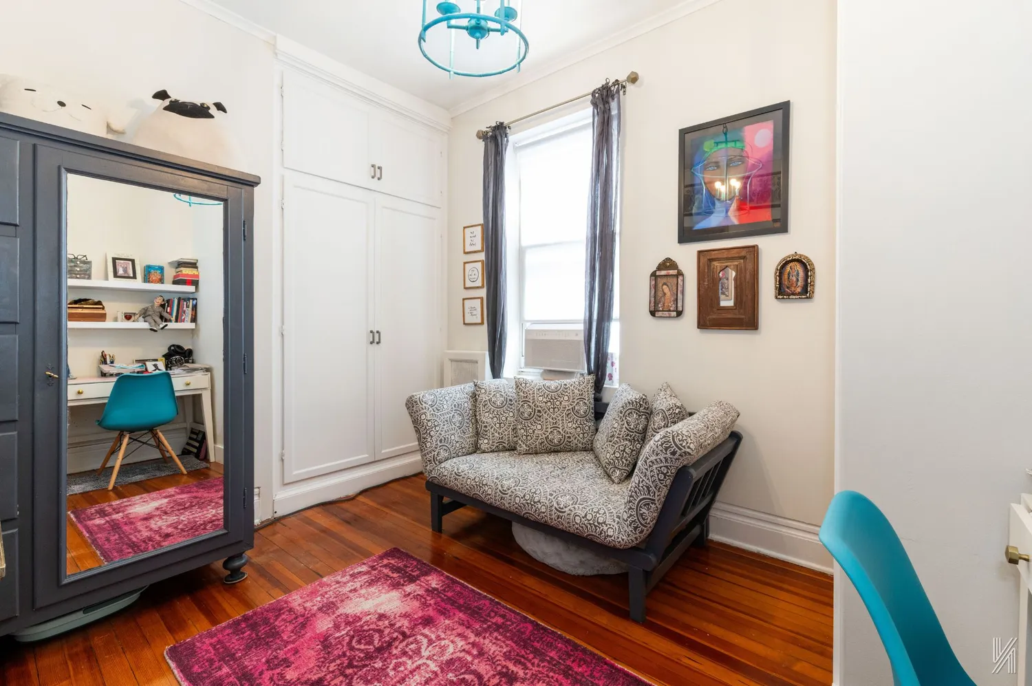 a living room with furniture and a rug