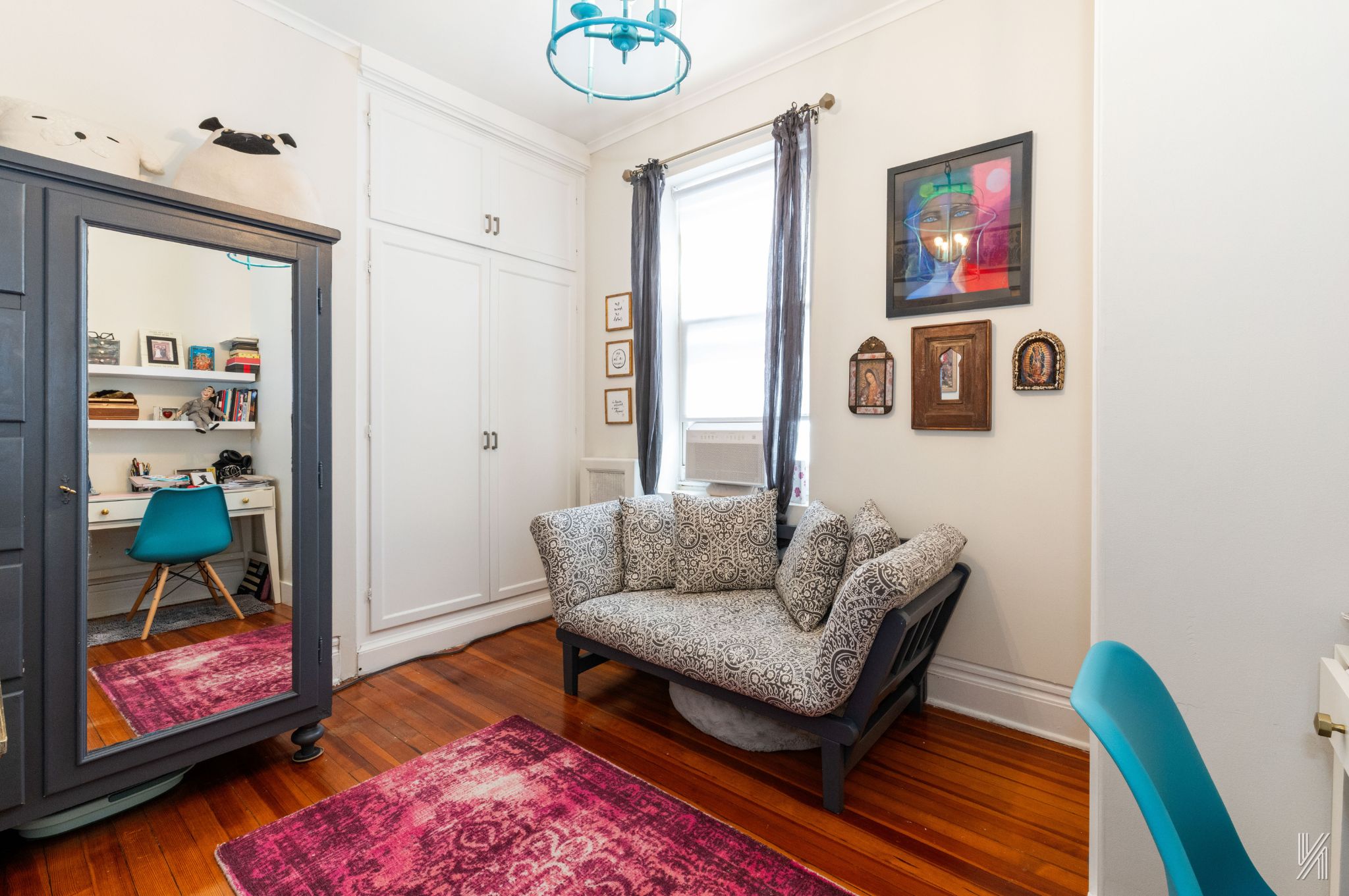 34-39 82nd Street, Unit 52 Queens, NY 11372 - Photo 10 of 18 a living room with furniture and a rug